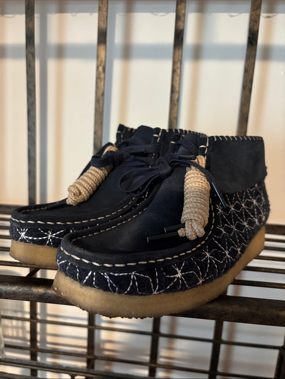 Clarks Navy Sashiko Suede Moccasin Boots with Cream Rope Detail